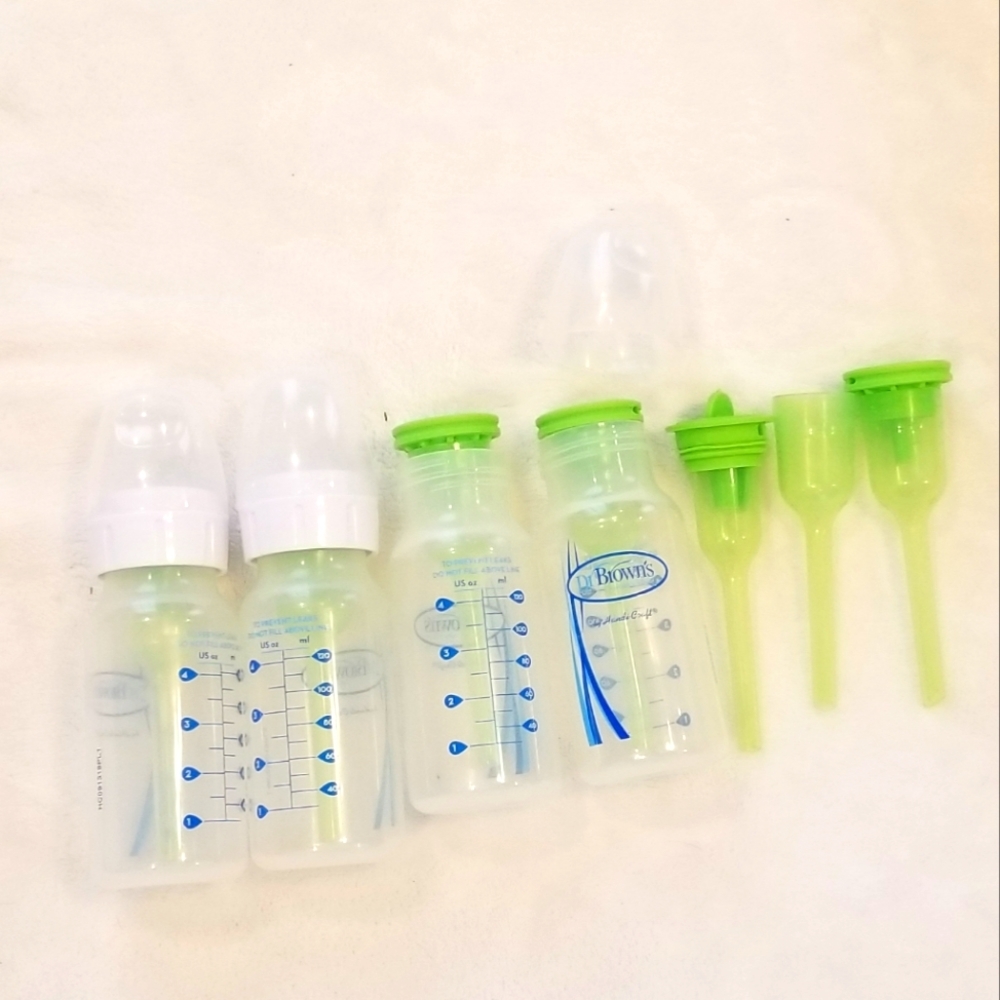 Four Dr. Brown's 4 oz bottles with extra peices nipples not included